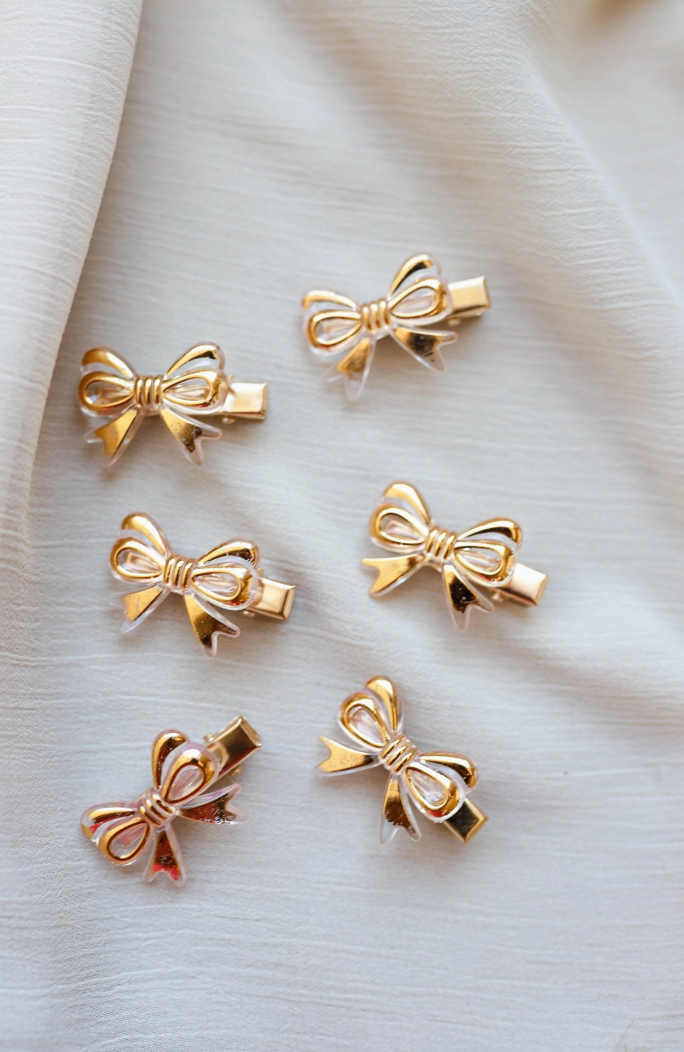 kaxi pretty little thing gold bow clips