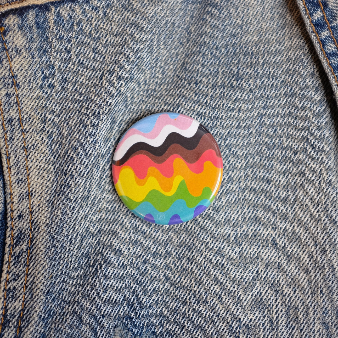 inclusive wavy pride rainbow button