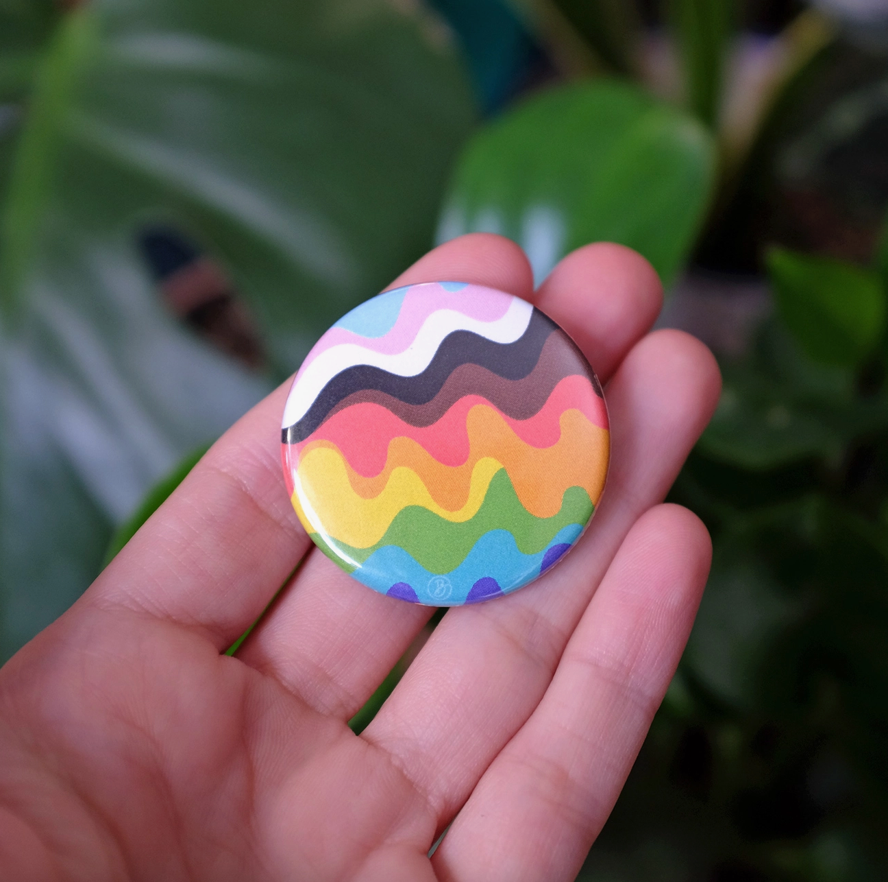 inclusive wavy pride rainbow button
